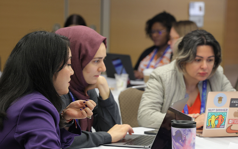 Attendees smiling and talking at ASCP
